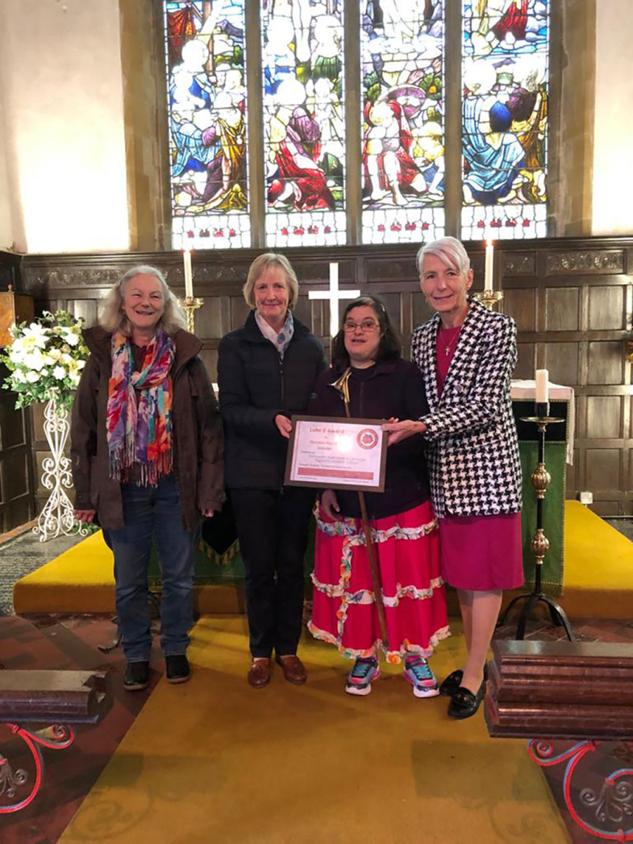 Photo of Sarah at her church giving the Luke 5 award to her two Churchwardens, Carolyn Cast and Angie Yeoman, with her mum Lesley who helped her to make the nomination.